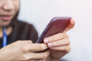 Women hands close-up using smartphone