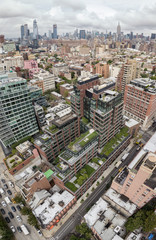Fototapeta na wymiar Aerial view of a modern apartment building with Manhattan skyline