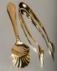 Golden Sugar Utensils Reflections