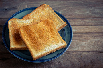 Sliced toasts on blue plate