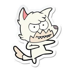 sticker of a cartoon grinning fox