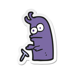 sticker of a cartoon little alien