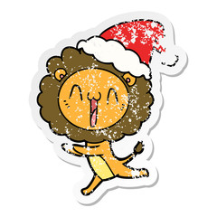 happy distressed sticker cartoon of a lion wearing santa hat