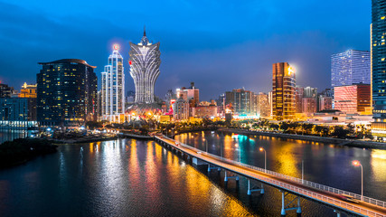 Fototapeta na wymiar Macau cityscape at night, all hotel and tower are colorful lighten up with blue sky, Macau, China.