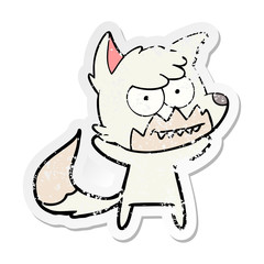distressed sticker of a cartoon grinning fox