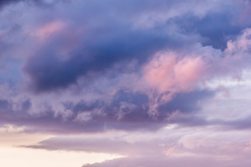 Sky with cumulus clouds at sunset or dawn. Clouds as background