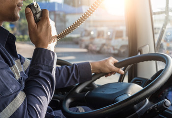 Truck Driver Making Talking Through Radio,Communication on the Highway,Concept transport on road,spot focus. © KM.Photo