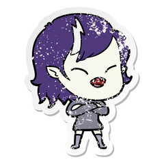 distressed sticker of a cartoon laughing vampire girl with crossed arms