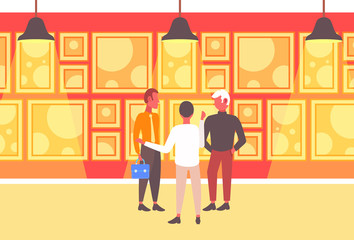 businessmen group having meeting three business men talking about new project standing together art gallery interior partnership concept flat full length horizontal