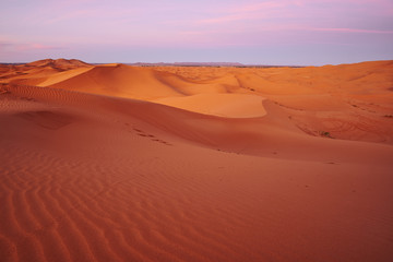 Fototapeta na wymiar Beautiful colorful sunrise at a sand dune in Sahara desert Morocco Africa