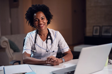 Portrait of smiling African American female doctor at her office.