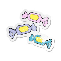 retro distressed sticker of a cartoon wrapped candy