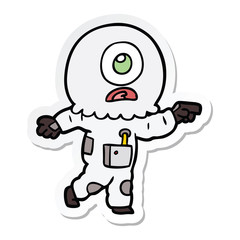 sticker of a cartoon cyclops alien spaceman pointing