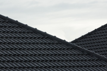 Fototapeta na wymiar rain storm downpour on black roof tile of residential house