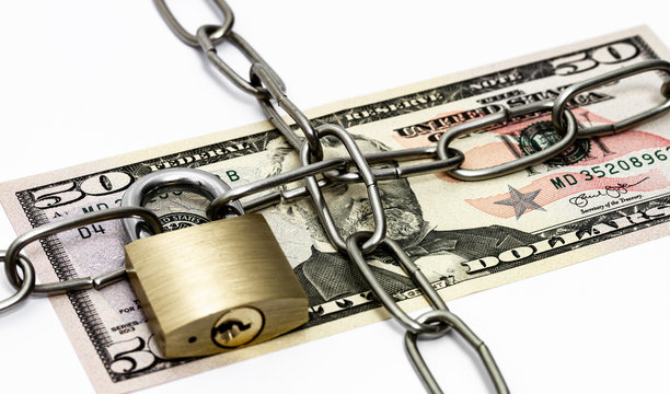 US dollar with padlock and chain