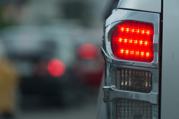 red tail light brake of stop car on road traffic jam