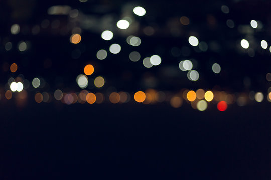 colorful night light in the city, image blur nightlife background © sutichak
