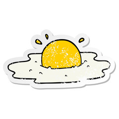distressed sticker of a cartoon fried egg