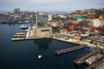 2013 - Sea facade in the capital of the Far East, the city of Vladivostok. Sea trading port with...