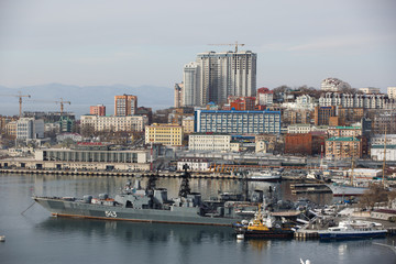 Fototapeta premium 2013 - Sea facade in the capital of the Far East, the city of Vladivostok. Sea trading port with ships. Drifting ships in the raid. 