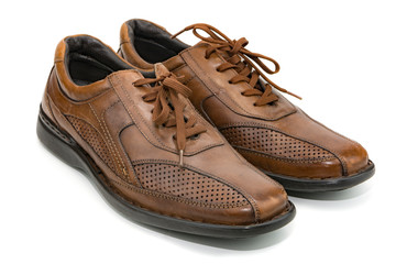 Brown, genuine leather men's shoes with laces on the isolate 
