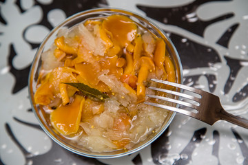 marinated mushrooms on the table, tasty snack