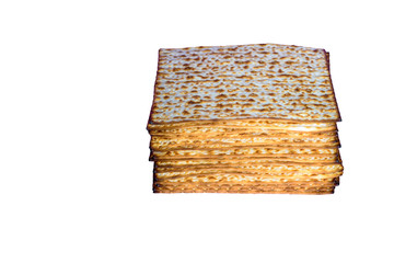 Stack of Matzah on a white background. Pile of Matza -Jewish traditional Passover unleavened bread. Pesach celebration symbol.
