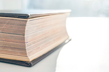 Hardcover Book, Fore Edge, Closed Pages On White Background on a Sunny Day. Reading, Textbook,...