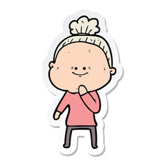 sticker of a cartoon happy old woman