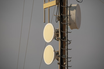 Telecommunication TV antennas with cell phone antennas and satellite dish