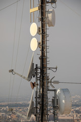 Telecommunication TV antennas with cell phone antennas and satellite dish