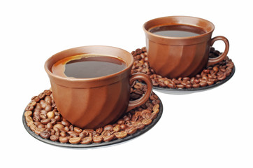Two cups of coffee, coffee beans on the table