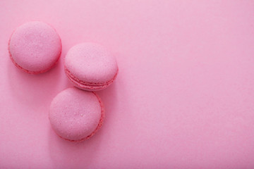 pink macaroons on pink background