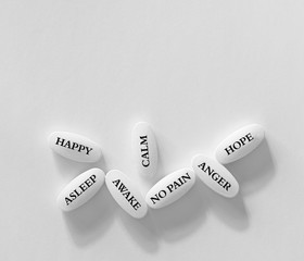 Pills or tablets on white background