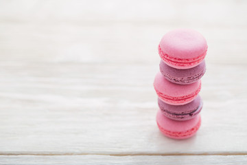 pink macaroons on wooden background