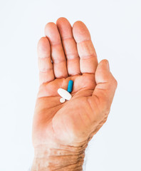Man holding pills