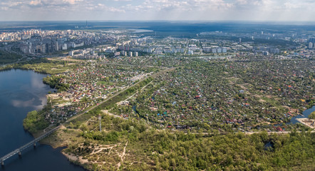 Aerial top view of Kiev city from above, Kyiv skyline and Dnieper river cityscape in spring, Ukraine