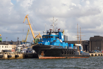 Offshore supply tug ship in the seaport.