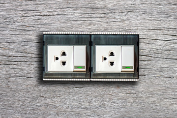 Light switch on wood wall