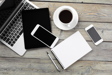 Open laptop with digital tablet and smartphone close up