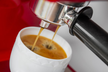 Coffee machine preparing a cup of coffee. Closeup, selective focus