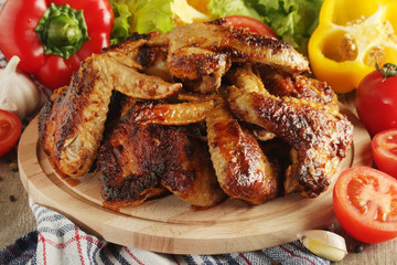 Chicken wings barbecue with different vegetables