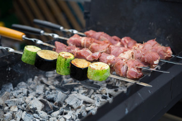 Grilled kebab meat on metal skewer