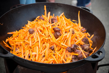 Traditional pilaf rice dish in a cauldron