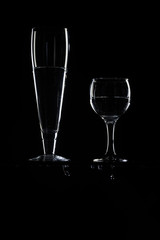 set of transparent glasses on black background 