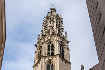 Fototapeta premium Vienna, Austria - December 31, 2017. Close view of openwork spire of Maria am Gestade aka St. Mary on the Bank - oldest gothic viennese church. Details of medieval lacy bell tower.