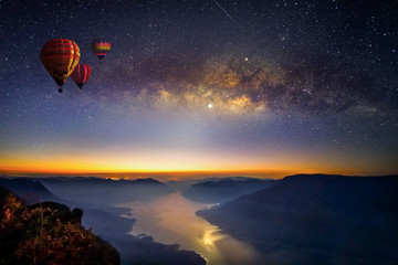 Milky way and balloons before sunrise on view point with long exposure photograph, with grain at...