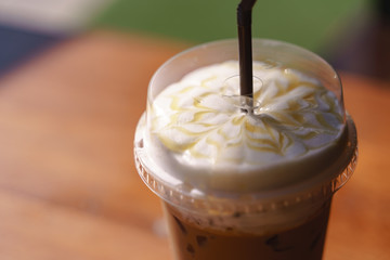 Plastic cup of iced latte coffee