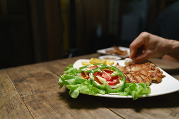 Adjust and clean steak dish.