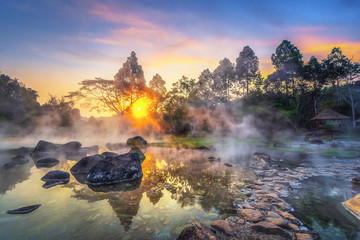 Chae Son National Park, Hot springs over rocky terrain with misty and morning sunrise rays of sun...